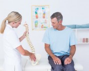 female chiropractor with patient