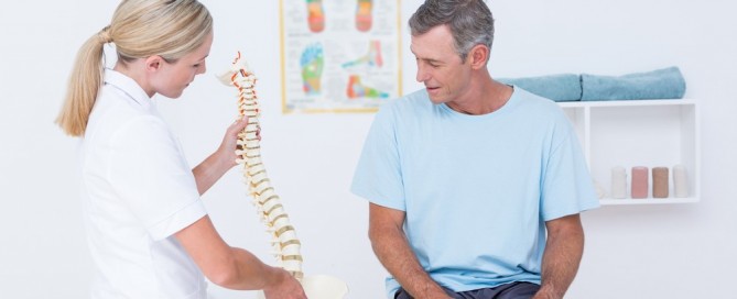 female chiropractor with patient