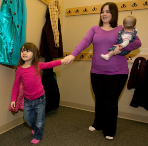 A woman with her kids after receiving treatment for chronic pain